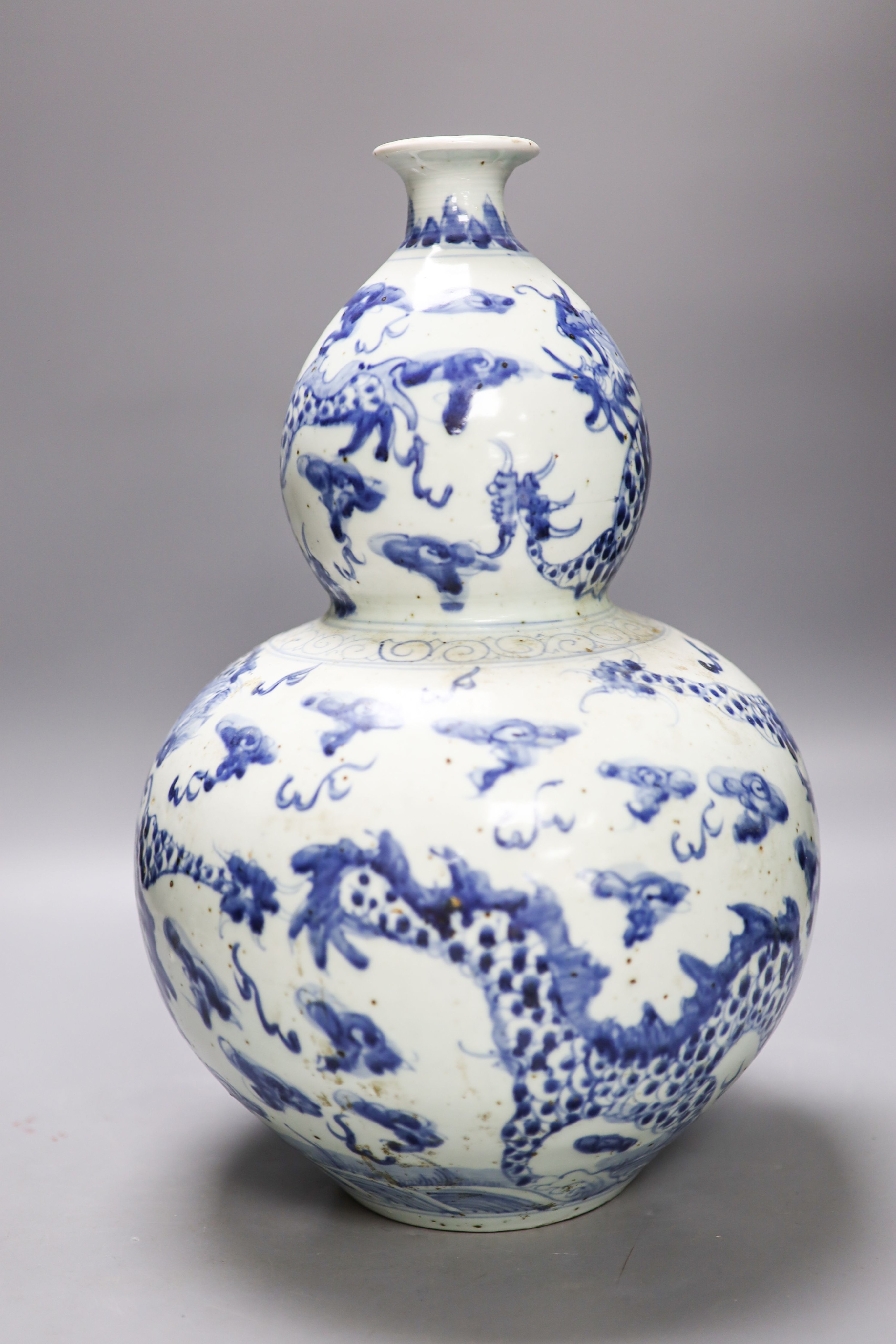 An impressive Chinese blue and white double gourd ‘dragon’ vase 37cm